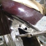 Before and after photographs of a damaged Chevy Impala that was repaired by Elite Paint & Body Shop in West Palm Beach, Florida.